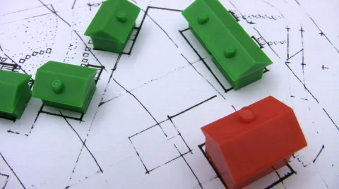 Red and green model houses on a real estate housing plan. Stock Footage