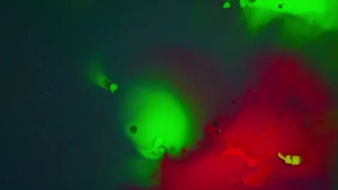 Red and Green Paint Bubbles explode. Multicolor Neon Ink Splatter Spreading from Stock Footage 274028792
