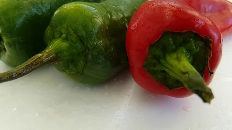 Red and green pepper drip water slow-motion Stock Footage 88529288