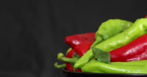 Red and green pepper rotating on black background 8 Stock Footage 139817889