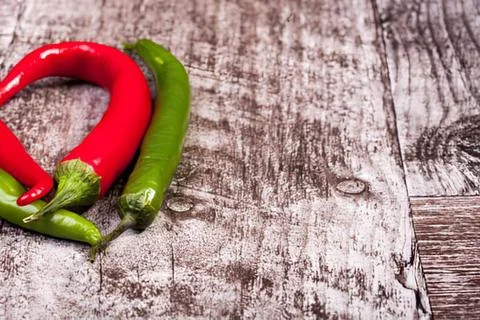 Red and green question mark symbol on textured background Stock Photos