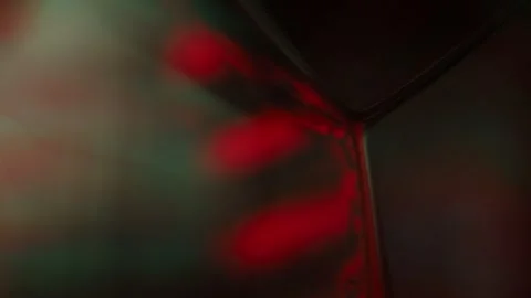 Red and green reflections of liquid in macro, dark horror background Stock Footage 279861040