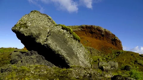 Red and grey rocks covered with moss Stock Footage 73011246