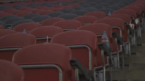 Red and Grey Stadium Seating After A Game Stock Footage 118095537