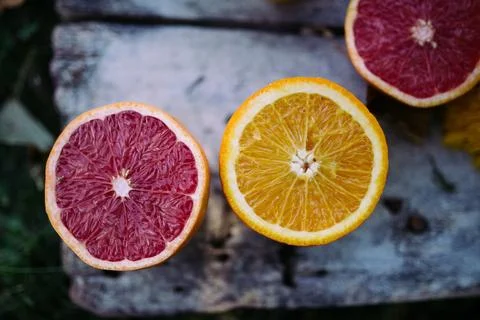 Red and natural orange on the rustic table in nature. Stock Photos
