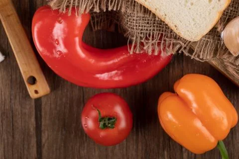 Red and orange chili pepper with tomato Stock Photos