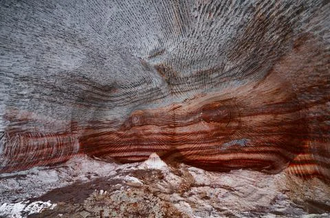 Red and orange patterns on ceiling of sylvinite salt quarry Stock Photos