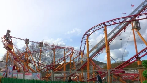Red and orange roller coaster Stock Footage 84479549