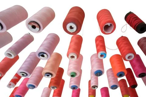 Red and pink sewing thread spool isolated on white background. Different shad Foto stock