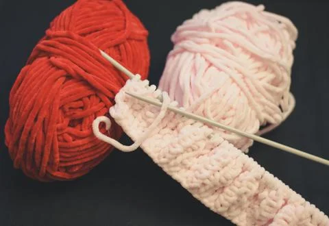 Red and pink threads for knitting Stock Photos