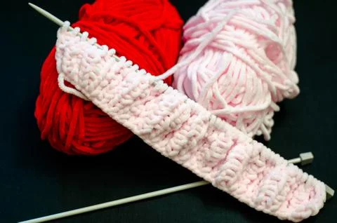 Red and pink threads for knitting Stock Photos