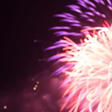 Red and purple light burst blur fireworks Stock Photos