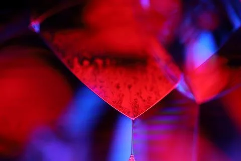 Red and purple liquid surface reflection, multicoloured art Stock Photos