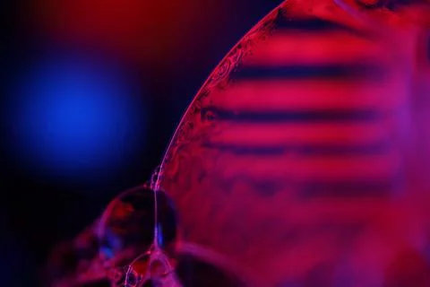Red and purple liquid surface reflection, multicoloured art Stock Photos