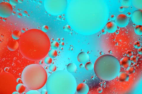 Red and turquoise spots with multi-colored circles, similar to the galaxy a.. Stock Photos