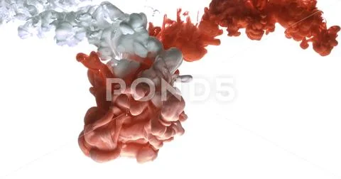Red and white acrylic paint cloud spraying in water on white background. Stock Photos