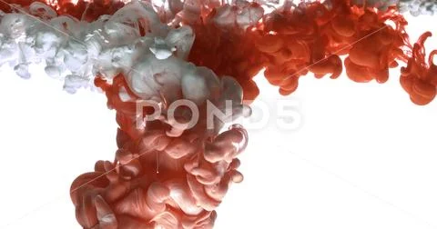 Red and white acrylic paint cloud spraying in water on white background. Stock Photos