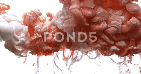 Red and white acrylic paint cloud spraying in water on white background. Stock Photos