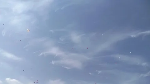 Red and white balloons in sky Stock Footage 257905603