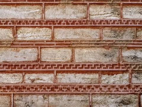 Red and white brick wall with patterned seams Stock Photos