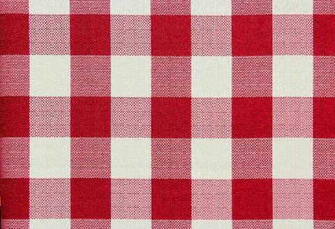 Red and white checkered table cloth background. Textile pattern. Stock Photos