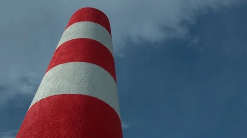 Red and white chimney with blue sky Stock Footage