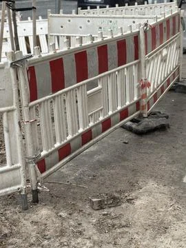 Red and White Construction Barriers on Street Stock Photos