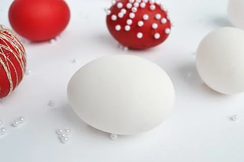 Red and White Easter Eggs Decorated on White Background. Stock Photos