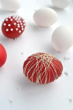Red and White Easter Eggs Decorated on White Background. Stock Photos