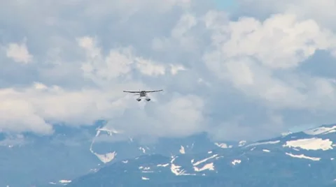 Red and White Floatplane on Approach Stock Footage 8602011
