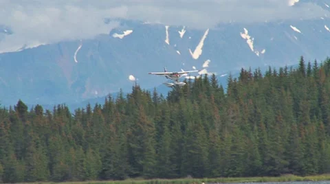 Red and White Floatplane Landing Stock Footage 8607117