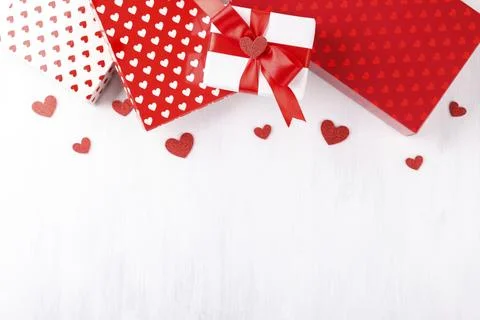Red and white gift boxes with hearts, Valentine's or mother's day background Stock Photos