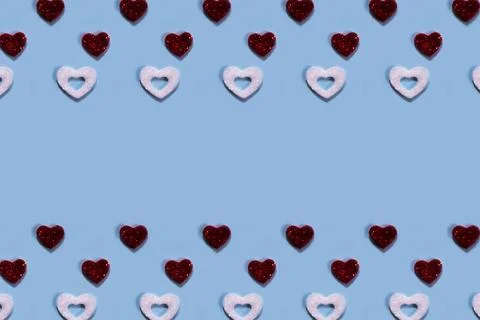 Red and white hearts pattern on blue background. Stock Illustration