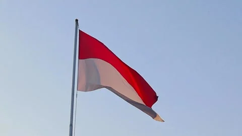 The red-and-white Indonesian flag that flutters above the sky Stock Footage 292903178