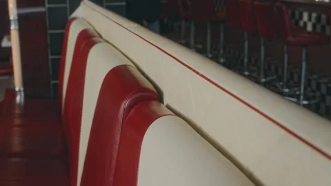 Red and White Leather Sofas in Empty 1970s American Diner 動画素材 276607454