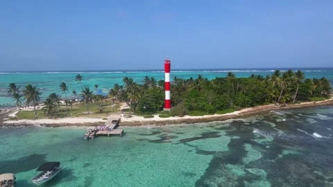 Red and white lighthouse on San Andres islet with turquoise sea Stock Footage 331255278