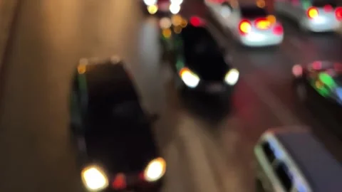 Red and white lights bokeh. Cars flow out of focus on road on street Video stock 298702879