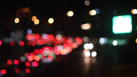 Red and white lights bokeh. Cars flow out of focus on road Video stock 312514196