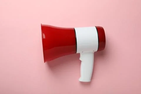 Red and white megaphone on pink background Stock Photos