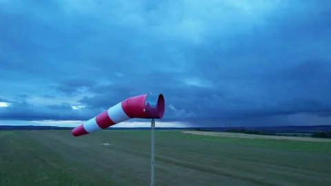 A red and white meteorological wind vane indicates the strength and direction of Stock Footage 165522179