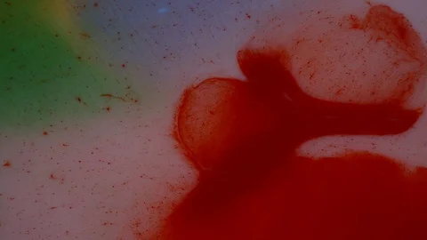 Red and white paints spread out. Video Stockbeeldmateriaal 122317422