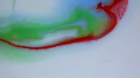 Red and white paints spread out. Video Stockbeeldmateriaal 122317565