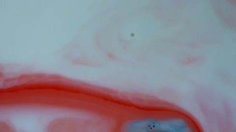 Red and white paints spread out. Video Stockbeeldmateriaal 122417646