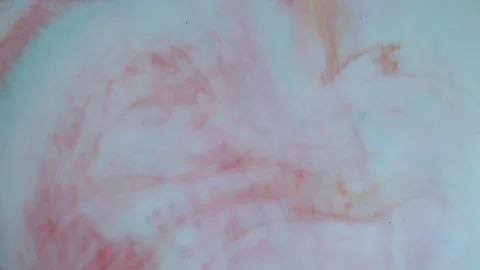 Red and white paints spread out. Video Stock Footage 123777940