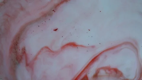 Red and white paints spread out. Video Stock Footage 123777956