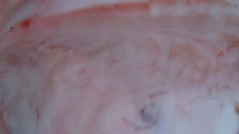 Red and white paints spread out. Video Stockbeeldmateriaal 123777966