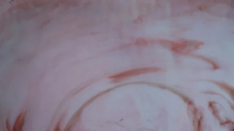 Red and white paints spread out. Video Stock Footage 123777979