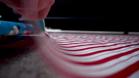 Red and White Paper Being Cut to Length Close Shoot Stock Footage 145035181