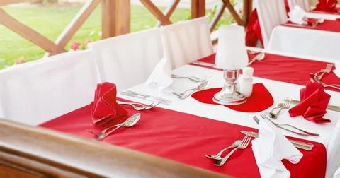 Red and white restaurant table setting for Valentine s Day, wedding and ann.. Stock Photos
