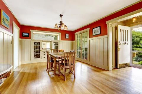 Red and white spacious dining room  with exit to backayrd area Stock Photos